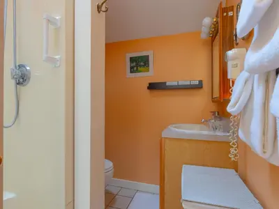 a bathroom with a sink and a toilet at Shaker Mill Inn in West Stockbridge