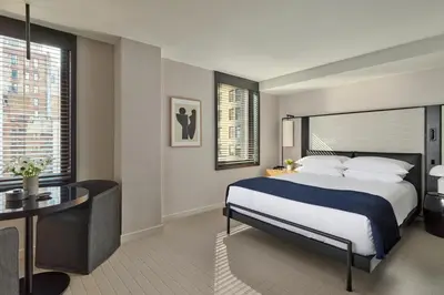 a hotel room with a bed and a desk at Hotel AKA NoMad in New York