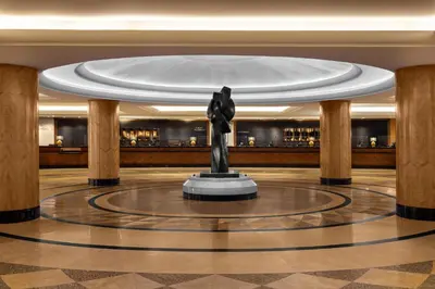 a statue in the lobby of a hotel at New York Hilton Midtown in New York
