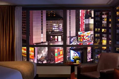 a view of a city from a window at night at Millennium Hotel Broadway Times Square in New York