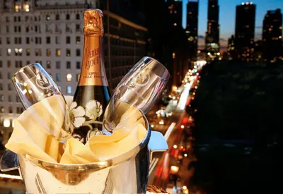 a bottle of champagne in a bucket on a building at The Sherry Netherland in New York
