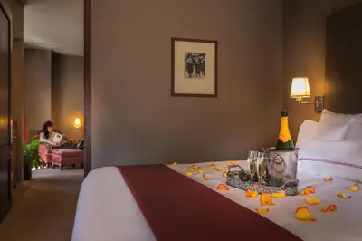 a hotel room with a bed with flowers on it at Hotel Giraffe by Library Hotel Collection in New York