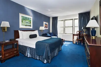 a hotel room with a large bed and a desk at Murray Hill East Suites - Extended Stay in New York