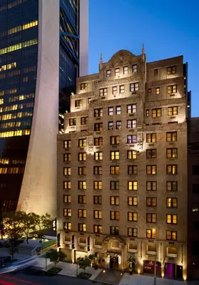 a building in the middle of a city at night at AKA Central Park in New York