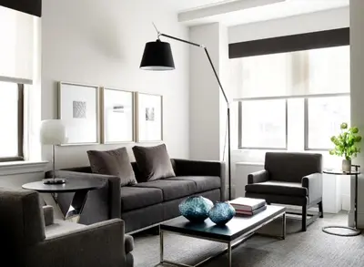 a living room with a couch and a table at AKA Central Park in New York