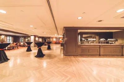 a banquet hall with a buffet in a building at The Michelangelo New York in New York