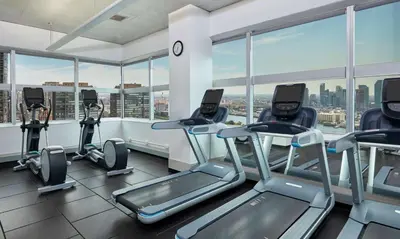 a gym with cardio equipment in a building at Millennium Hilton New York One UN Plaza in New York