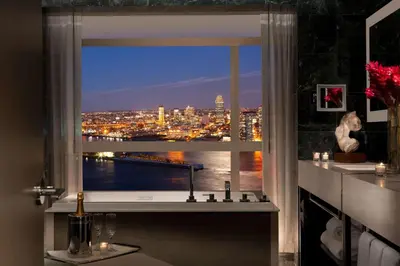 a window with a view of a city at night at Millennium Hilton New York One UN Plaza in New York