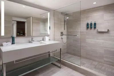 a bathroom with a sink and a shower at Millennium Hilton New York One UN Plaza in New York