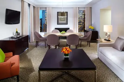 a living room with a couch and a table at Omni Berkshire Place in New York