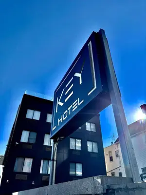 a hotel sign in front of a building at Hotel Key in Queens