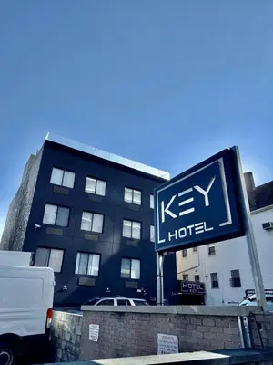 a hotel sign in front of a building at Hotel Key in Queens