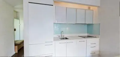 a kitchen with white cabinets and a sink at Club Wyndham Midtown 45 in New York