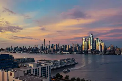 a view of a city with a river and buildings at Sheraton Lincoln Harbor Hotel in Weehawken