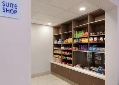 a store aisle with shelves of food at Holiday Inn Express & Suites Bradley Airport by IHG in Windsor Locks