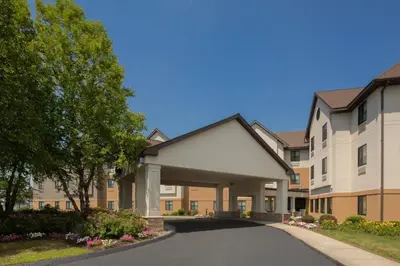 a rendering of a building with a driveway at Holiday Inn Express & Suites Bradley Airport by IHG in Windsor Locks