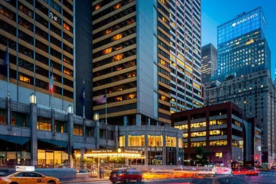 a busy city street with cars in front of tall buildings at Sheraton New York Times Square Hotel in New York