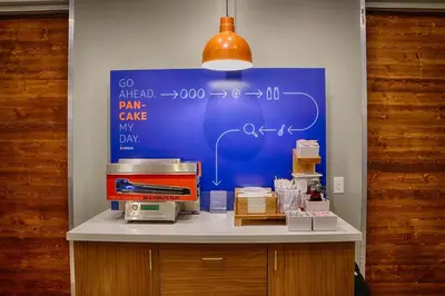 a counter with a blue board with formulas on it at Holiday Inn Express & Suites - Middletown - Goshen by IHG in Middletown
