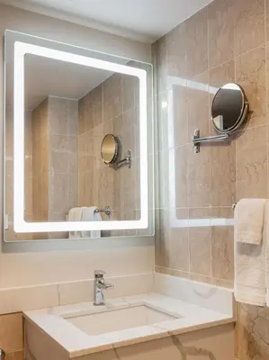 a bathroom with a sink and a mirror at Westgate New York Grand Central in New York