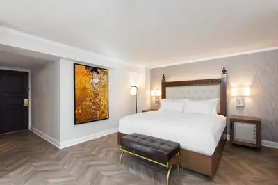 a bedroom with a bed and a painting on the wall at Westgate New York Grand Central in New York