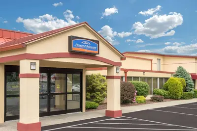 a building with a sign on the front of it at Howard Johnson by Wyndham Saugerties in Saugerties