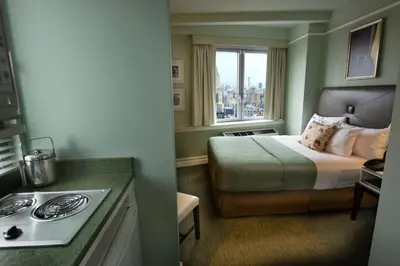 a hotel room with a bed and a window at Hotel Beacon in New York