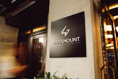 a sign for a restaurant on the side of a building at Paramount Times Square - A Generator Hotel in New York