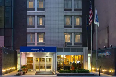 a facade of a building with an american flag at Hampton Inn Madison Square Garden in New York