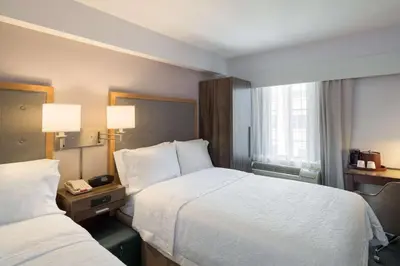 a hotel room with two beds and a window at Hampton Inn Madison Square Garden in New York
