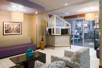 a living room with a couch and chairs at Hampton Inn Madison Square Garden in New York