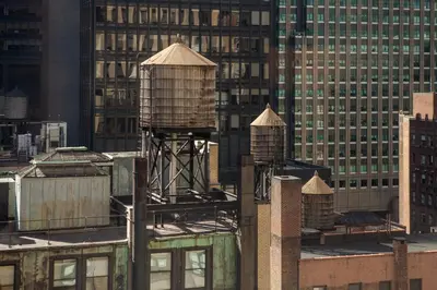 a group of water towers on top of a building at Park Central Hotel New York in New York