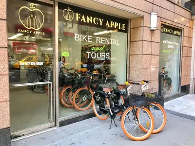 a group of bikes parked in front of a store window at Park Central Hotel New York in New York
