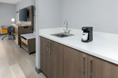 a kitchen with a sink and a counter top at Hampton Inn Hartford Airport in Windsor Locks