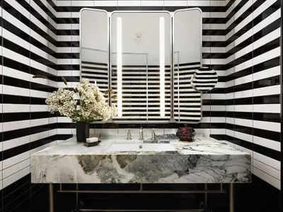 a bathroom with a sink and a mirror at Park Lane New York in New York