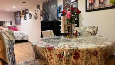 a room with a table and chairs and a room with a bedroom at Garden Suite 30 Mins to NYC, Mins to EWR, Prudential Center, NJPACK in Belleville