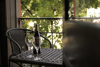 a table with a bottle of wine and two glasses at Hotel Wayne in Honesdale