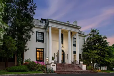 a large white house with columns and a porch at Tarrytown House Estate in Tarrytown