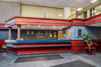 a lobby of a courthouse with red and blue at Quality Inn & Suites Albany Airport in Latham