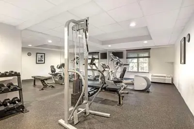 a gym with treadmills and exercise equipment in a room at Best Western Hartford Hotel and Suites in Hartford