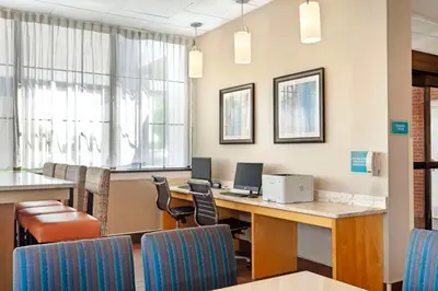 an office with a desk with a computer and chairs at Best Western Hartford Hotel and Suites in Hartford