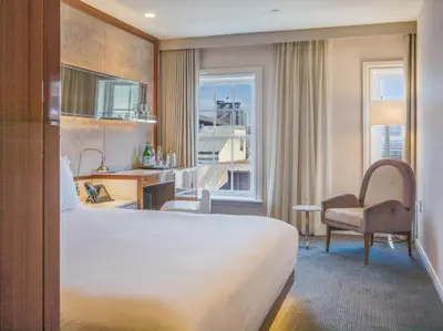 a hotel room with a large bed and a window at 33 Hotel, New York City, Seaport in New York