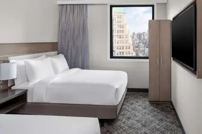 a hotel room with a bed and a television at DoubleTree by Hilton New York Times Square South in New York