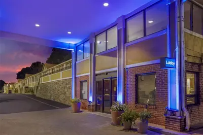 a building with blue lights on the side of it at Best Western Fort Lee in Fort Lee