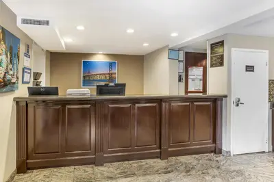 a lobby with a reception desk in a hospital at Best Western Fort Lee in Fort Lee
