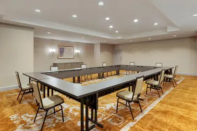 a large conference room with a large table and chairs at Omni New Haven Hotel at Yale in New Haven