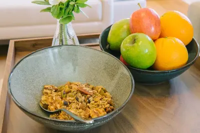two bowls of food on a table with fruit at The Abbey Inn & Spa in Peekskill