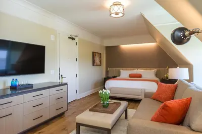 a bedroom with a king sized bed and a television at The Abbey Inn & Spa in Peekskill