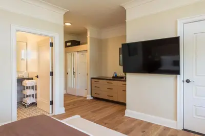 a bedroom with a flat screen tv on a wall at The Abbey Inn & Spa in Peekskill