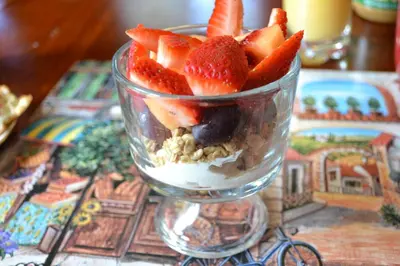 a cup filled with fruit and nuts on a table at Mountain Treasure Bed and Breakfast in Maplecrest