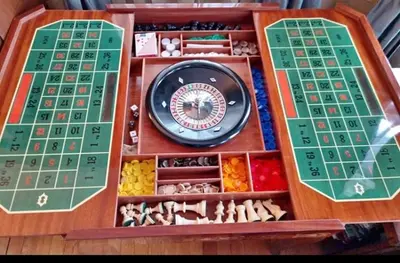 a board game with a clock in a wooden box at Roscoe Cabin Pet friendly in Roscoe